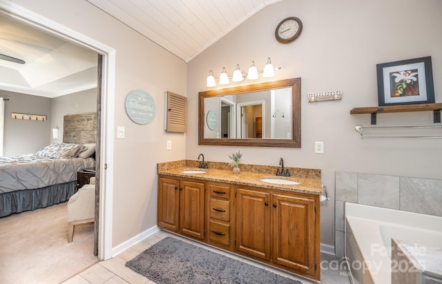 full bath with vaulted ceiling, ensuite bath, a garden tub, and a sink