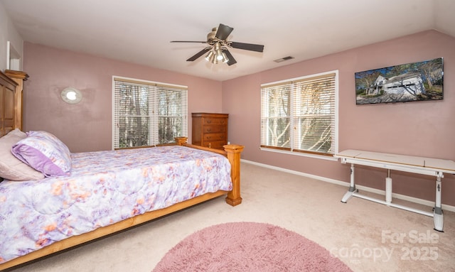 bedroom featuring visible vents, multiple windows, carpet, and baseboards