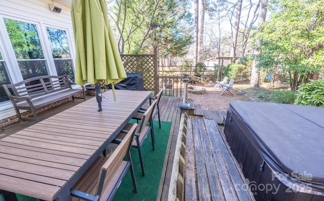 wooden deck featuring outdoor dining space