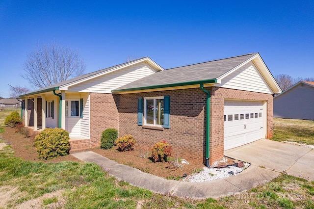 view of front of property with concrete driveway, an attached garage, and brick siding