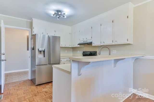 kitchen with stainless steel fridge with ice dispenser, under cabinet range hood, light countertops, a kitchen bar, and a peninsula