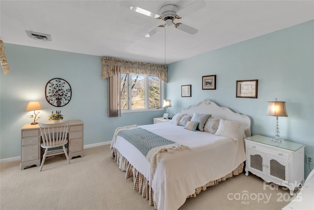 bedroom with light colored carpet, baseboards, visible vents, and ceiling fan