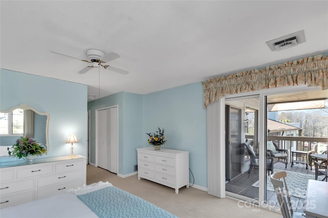 bedroom featuring multiple windows, baseboards, visible vents, and light carpet