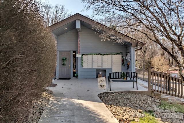 doorway to property with concrete driveway