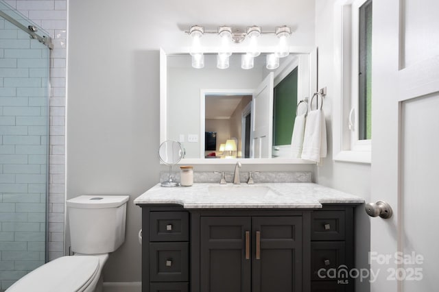 bathroom featuring toilet and vanity