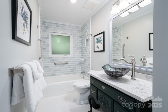 bathroom featuring bathing tub / shower combination, ornamental molding, vanity, and toilet