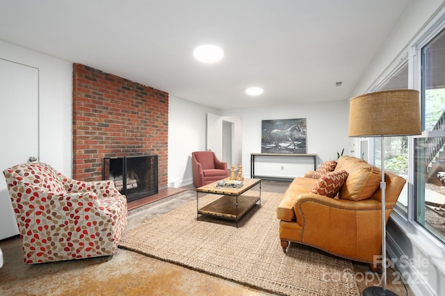 living area with a brick fireplace