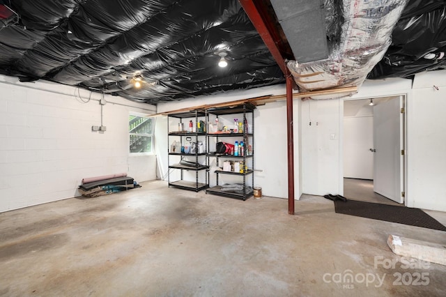 basement featuring concrete block wall