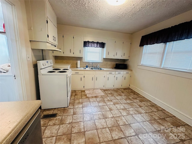 kitchen with light countertops, white electric range, white cabinets, a sink, and under cabinet range hood