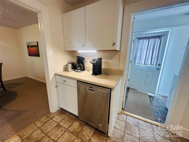 kitchen with light carpet, white cabinetry, baseboards, light countertops, and stainless steel dishwasher