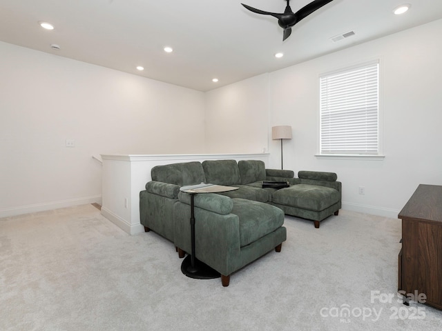 living area featuring visible vents, light carpet, a ceiling fan, recessed lighting, and baseboards