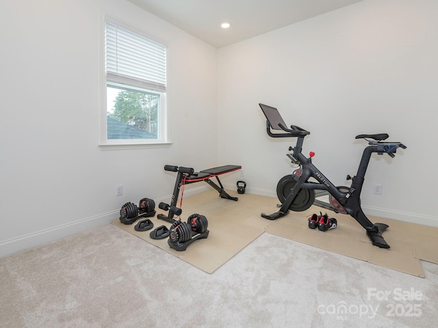 exercise room featuring recessed lighting, baseboards, and carpet floors