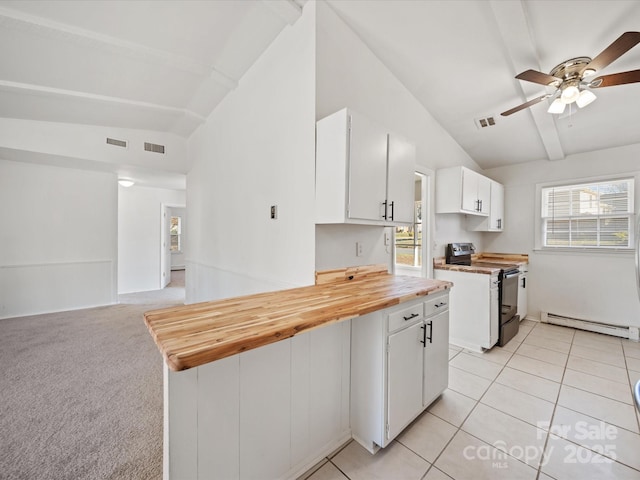 kitchen with visible vents, baseboard heating, stainless steel range with electric stovetop, and vaulted ceiling