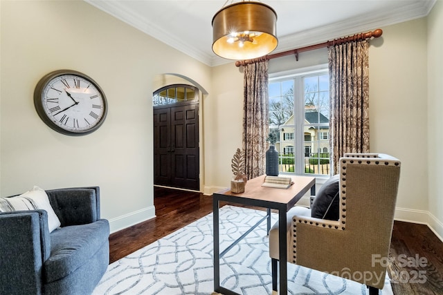 home office featuring baseboards, dark wood-type flooring, ornamental molding, and arched walkways