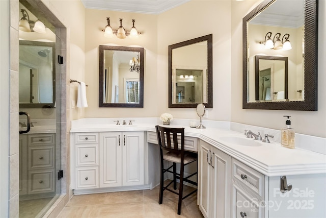 bathroom with a sink, a stall shower, and ornamental molding