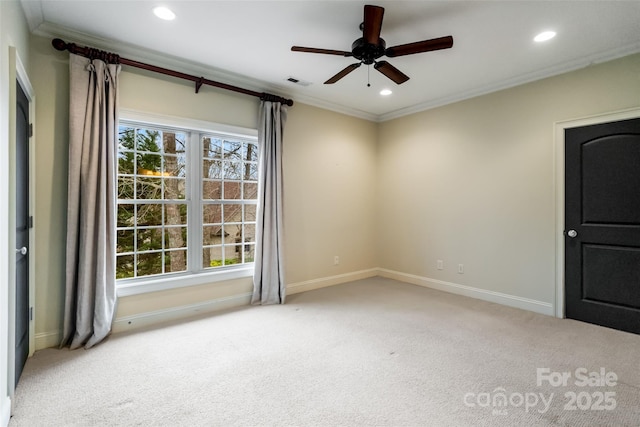 empty room featuring crown molding, carpet flooring, recessed lighting, and visible vents