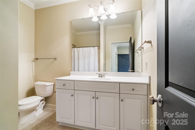 bathroom featuring vanity, tile patterned floors, toilet, and ornamental molding