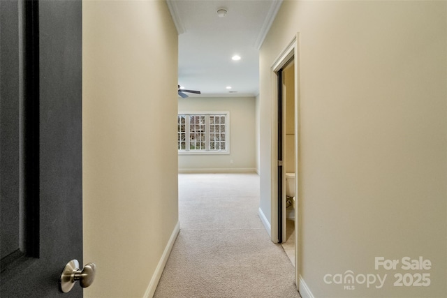 corridor with recessed lighting, baseboards, and light colored carpet