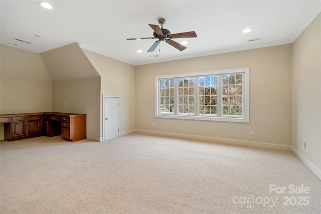 interior space with recessed lighting, baseboards, light colored carpet, and built in desk