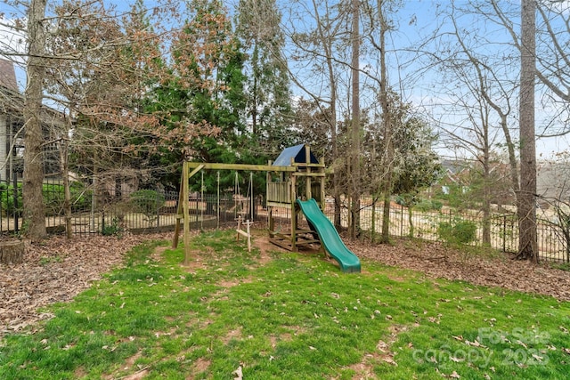 view of play area with a lawn and fence