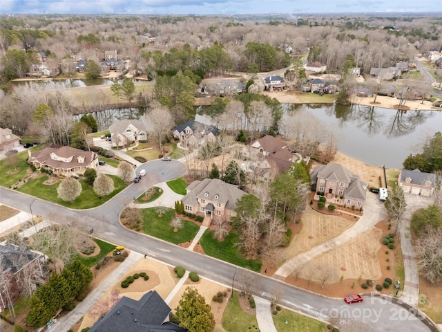 birds eye view of property with a residential view and a water view