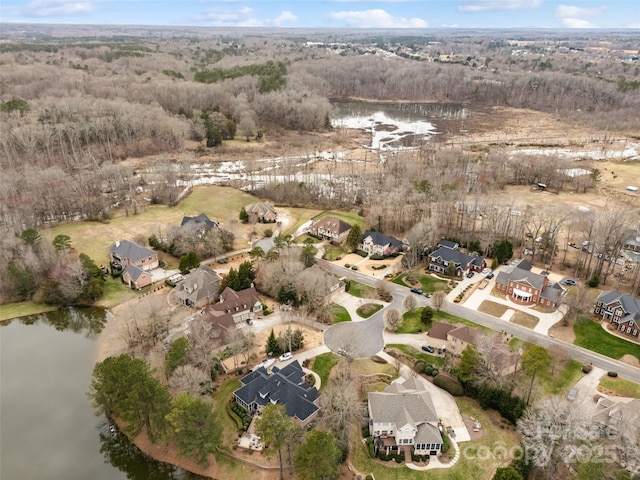 bird's eye view featuring a residential view and a water view