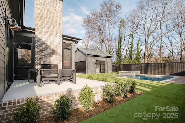 view of patio featuring a fenced backyard, a fenced in pool, and an outdoor structure