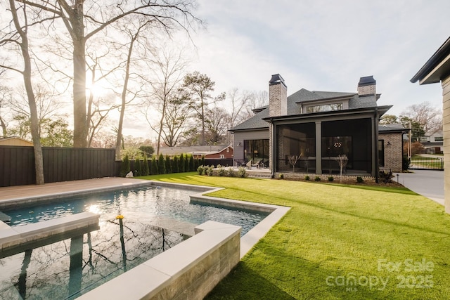 view of swimming pool with a fenced in pool, a lawn, a fenced backyard, and a sunroom