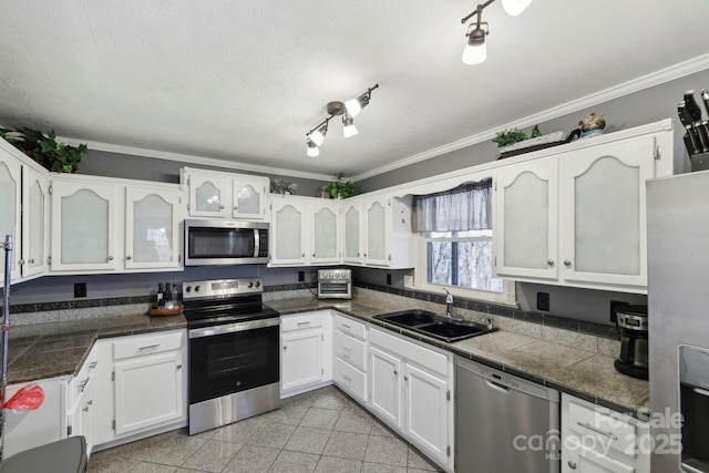 33 Milburn Ln, Hendersonville, NC 28792 - kitchen featuring ornamental molding, appliances with stainless steel finishes, granite finish floor, white cabinets, and a sink