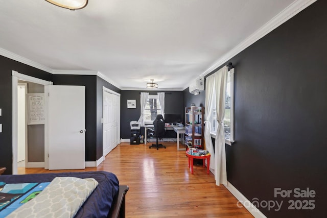 33 Milburn Ln, Hendersonville, NC 28792 - bedroom with an AC wall unit, crown molding, wood finished floors, and baseboards