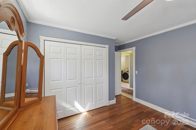 33 Milburn Ln, Hendersonville, NC 28792 - unfurnished bedroom featuring washer / clothes dryer, baseboard heating, wood-type flooring, and crown molding