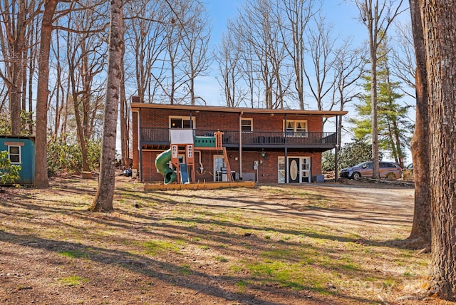 33 Milburn Ln, Hendersonville, NC 28792 - view of front of house featuring brick siding and a playground
