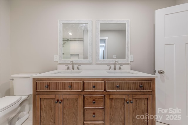 full bath featuring double vanity, toilet, and a sink