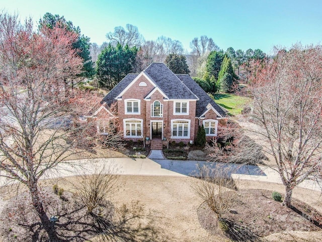 view of front of property with brick siding and french doors