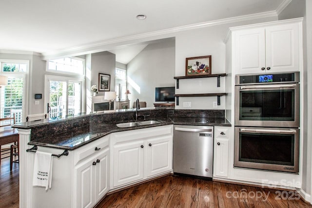 kitchen featuring a sink, ornamental molding, dark wood-style floors, stainless steel appliances, and open shelves