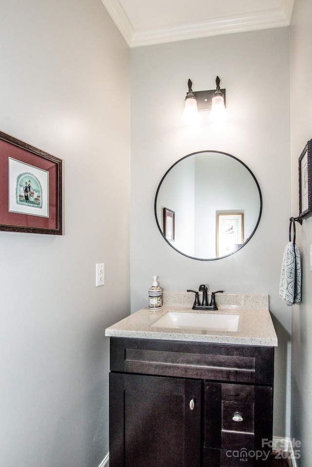 bathroom with vanity and ornamental molding