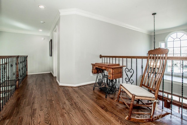 living area with dark wood finished floors, crown molding, recessed lighting, and baseboards