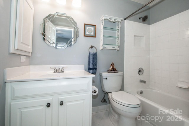 bathroom with vanity, toilet, baseboards, and shower / washtub combination