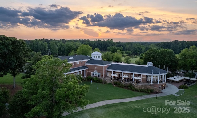 birds eye view of property with a wooded view