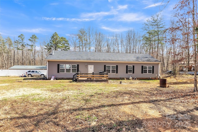 view of front of property featuring crawl space, a deck, and a front yard