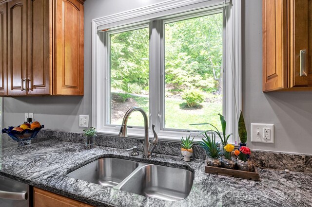 97 Ballantree Dr, Asheville, NC 28803 - kitchen featuring a sink, brown cabinetry, and dark stone counters