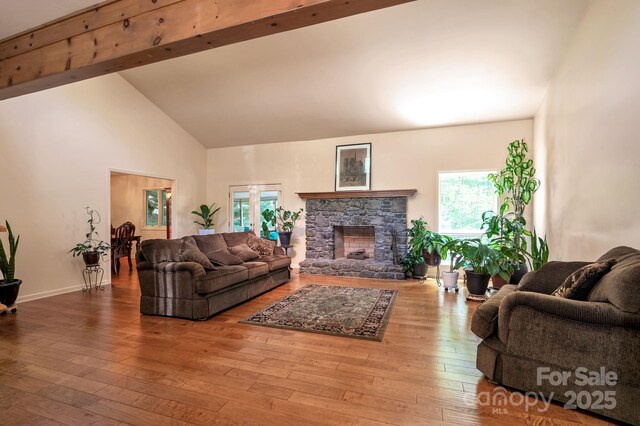 97 Ballantree Dr, Asheville, NC 28803 - living area featuring plenty of natural light, wood-type flooring, high vaulted ceiling, beam ceiling, and baseboards