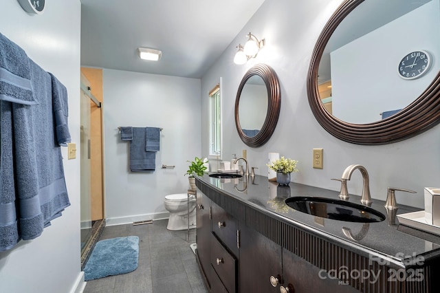 97 Ballantree Dr, Asheville, NC 28803 - full bathroom with toilet, double vanity, a stall shower, baseboards, and tile patterned floors