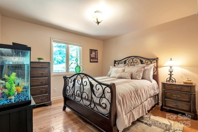 97 Ballantree Dr, Asheville, NC 28803 - bedroom with light wood-style floors and baseboards