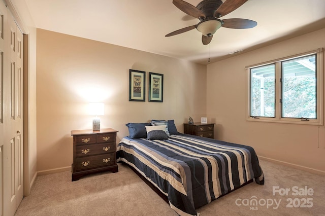 97 Ballantree Dr, Asheville, NC 28803 - bedroom with light carpet, baseboards, a closet, and a ceiling fan
