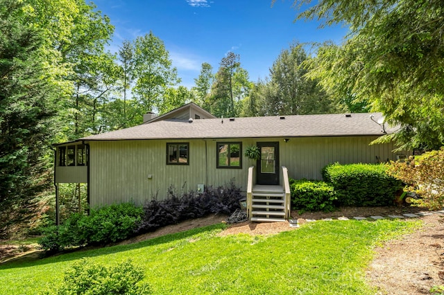 97 Ballantree Dr, Asheville, NC 28803 - view of front of home featuring a front yard, a chimney, and a shingled roof