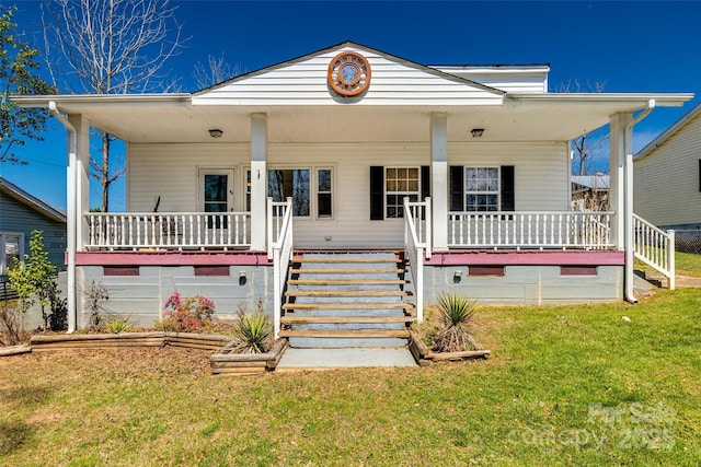 bungalow-style home with a front lawn and a porch