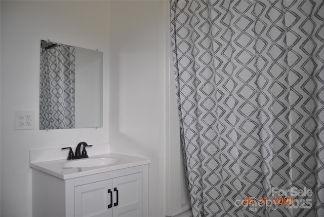 bathroom with vanity and a shower with shower curtain