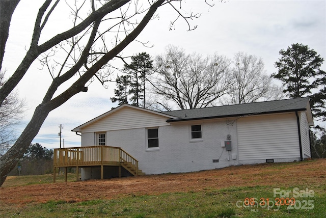 back of house with crawl space, a wooden deck, stairs, and brick siding