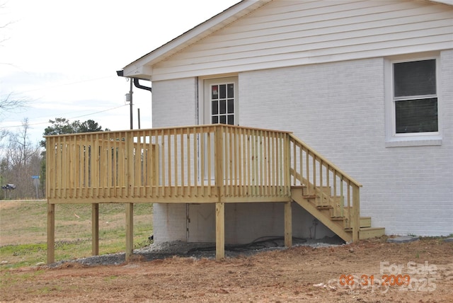 wooden terrace featuring stairs